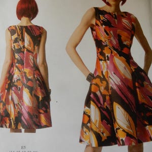 May include: A sleeveless dress with a colorful leaf pattern in shades of orange, pink, and black. The dress is shown on a model, with a matching pattern on the back. The Vogue Patterns American Designer label is visible.