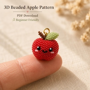 May include: A 3D beaded apple charm with a red body, a light green leaf, and a brown stem. The apple features a smiling face with black eyes and pink cheeks. Text reads: 3D Beaded Apple Pattern, PDF Download, Beginner Friendly.