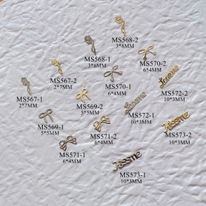 100pcs/bag Silver and Gold non-adhesive Soft Metal Slices Rose Bow Shape Nail Art Decoration M41