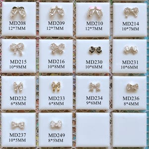 5 piezas de abalorios metálicos 3D de lujo con lazo de diamantes de imitación, perlas y diamantes de imitación para decoración de uñas, decoración para teléfono móvil.