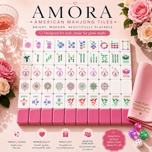 May include: A complete set of American Mahjong tiles with a pink base and white tiles. The tiles feature various symbols and numbers, with the word "AMORA" at the top. The set includes dice and a pink cloth.