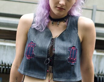 Denim crop top with voodoo dolls decoration patches mini skirt and little cape