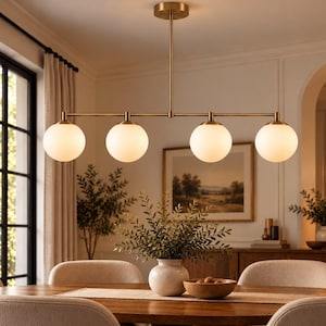 May include: A linear chandelier featuring a horizontal brass rod suspended from the ceiling, holding four evenly spaced spherical white frosted glass globes that emit a soft glow, creating a balanced and symmetrical lighting fixture.