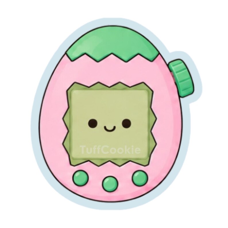 May include: A pink and light green egg-shaped digital pet toy sticker with a jagged top edge. The screen displays a simple black face with two eyes and a smile. Three small green circular buttons are at the bottom, and the text TuffCookie is visible.
