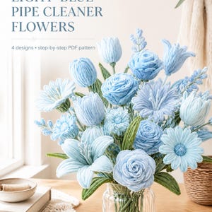 May include: A bouquet of light-blue pipe cleaner flowers in a clear glass vase. The text reads: LIGHT-BLUE PIPE CLEANER FLOWERS 4 designs • step-by-step PDF pattern. The flowers feature various petal shapes and green stems and leaves.