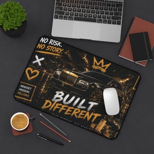 May include: Black and gold mousepad with a luxury car graphic and the text "BUILT DIFFERENT". The design includes a crown, a heart, and the words "NO RISK. NO STORY." and "MINDSET. MISSION. MILLIONS."