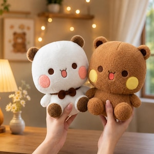 May include: Two plush bear toys, one white with brown ears and a brown bow tie, and one brown with yellow cheeks. Both feature dark brown eyes, a small pink mouth, and round blush patches on their cheeks, crafted from soft, textured fabric.