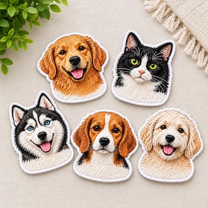 May include: Five embroidered patches featuring animal faces: a golden retriever, a black and white cat with green eyes, a husky with blue eyes, a beagle, and a light-colored doodle dog. Each patch has a white border and detailed stitching.
