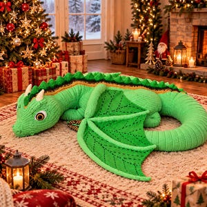 May include: A large, hand-crocheted green dragon plush toy featuring a long, coiled tail, textured wings with dark green stitching, a spiky dorsal ridge, and white horns. The dragon has large, detailed eyes with dark pupils and a light green body.