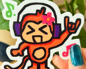 Die-cut monkey jamming out to music sticker