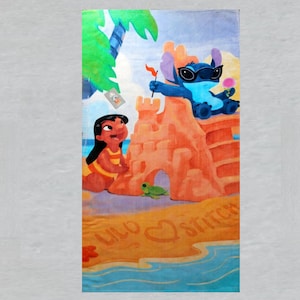 May include: Beach towel featuring a colorful illustration of Lilo and Stitch at the beach. Stitch is wearing sunglasses and holding a flag, while Lilo is building a sandcastle. The towel has the words "Lilo" and "Stitch" on it.