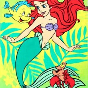 May include: A cartoon illustration of Ariel, the Little Mermaid, with red hair, a purple seashell top, and a teal tail. Flounder the fish and Sebastian the crab are also featured. The background is a mix of yellow and green.