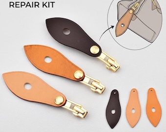 May include: A Speedy Zipper Pull Repair Kit featuring three teardrop-shaped leather tabs in dark brown, tan, and light beige, each attached to a gold-tone metal zipper slider. Three additional matching leather tabs are included separately.