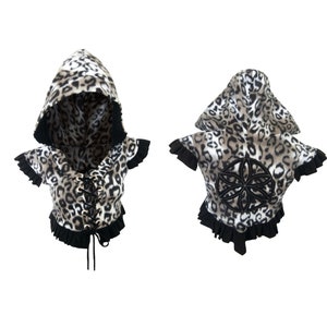 May include: A hooded, cropped top with a leopard print pattern and black lace-up detail at the front. The back of the top features a black embroidered flower design.
