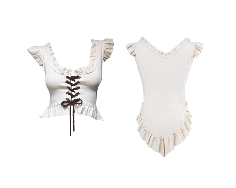 May include: A white sleeveless top with a lace-up front and a ruffled neckline and hem.