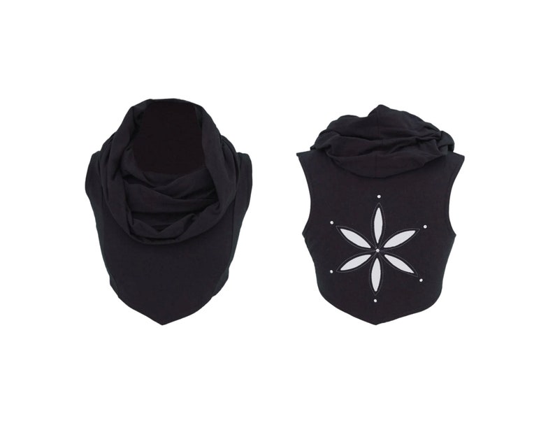 May include: Black sleeveless hooded top with a white flower design on the back.
