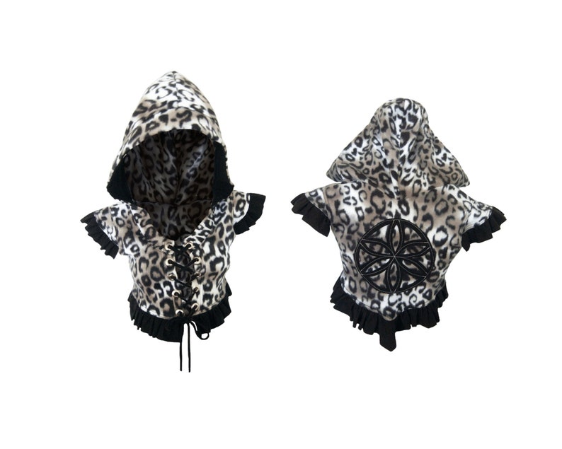 May include: A hooded, cropped top with a leopard print pattern and black lace-up detail at the front. The back of the top features a black embroidered flower design.
