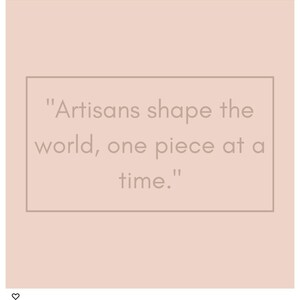 May include: A square graphic with a light peach background featuring a rectangular border in a darker shade. Inside the border, the text reads: "Artisans shape the world, one piece at a time." The typography is simple, clean, and centred within the frame.