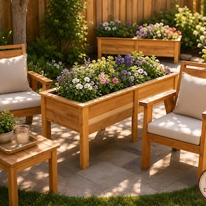 May include: A wooden outdoor furniture set consisting of two armchairs with light beige cushions, a rectangular wooden planter box filled with colourful flowers, and a small square side table holding a potted plant and a glass candle holder.