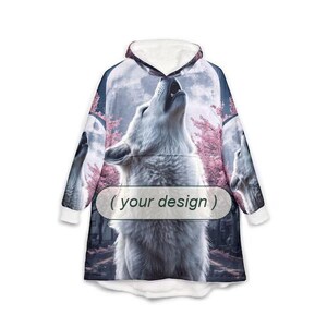 May include: A hooded sweatshirt featuring a large white wolf howling at a full moon against a backdrop of pink cherry blossom trees. The garment includes a central rectangular label with the text ( your design ) printed in black.