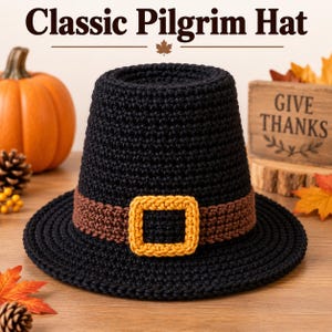 May include: A black crocheted hat with a flat top and a wide brim. The hat features a brown band around the base and a square yellow buckle centered on the front. The text "Classic Pilgrim Hat" is displayed above the hat in the image.