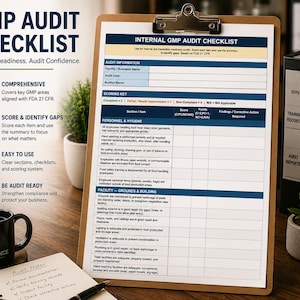 May include: A clipboard with an "Internal GMP Audit Checklist" and a black mug with "Quality Starts With Compliance" text. The checklist includes sections for audit information and scoring, with a notepad and pen in the foreground.