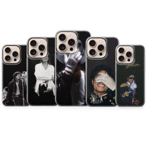 May include: A collection of five black phone cases featuring images of Michael Jackson. The cases display various iconic poses and outfits, including a sequined glove and fedora. The cases are designed to fit a specific phone model.