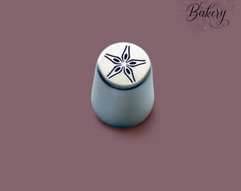 May include: A silver-colored metal piping tip with a conical shape and a flat top featuring a five-pointed star cutout design. The text "MY LITTLE Bakery" is printed in the upper right corner in a decorative black script font.