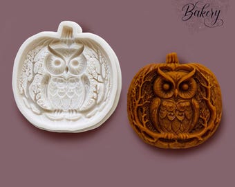 May include: A white silicone mold and a corresponding orange-brown molded piece, both featuring a detailed owl perched inside a pumpkin shape with surrounding tree branches. The text My Little Bakery is visible in the upper right corner.