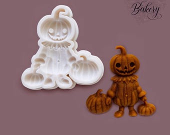 May include: A white silicone mold and a corresponding brown pumpkin-headed figure with a ruffled collar, holding two small pumpkins. The mold features the recessed design of the character, while the figure shows the detailed, textured result.