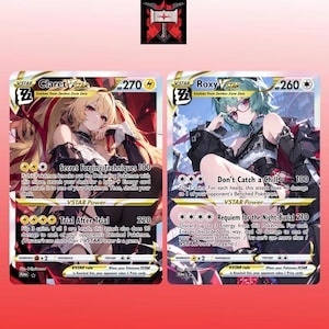 May include: Two collectible trading cards featuring anime-style characters named Claret VSTAR and Roxy VSTAR. Claret VSTAR has 270 HP and electric attacks, while Roxy VSTAR has 260 HP and colorless attacks. Both cards display detailed character art.