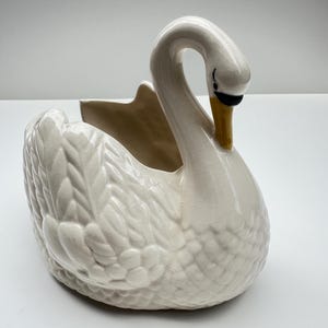 White ceramic swan planter