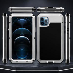 May include: A rugged smartphone case featuring a silver metal frame with black accents, shown from multiple angles including front, back, and side views. The case has a reinforced design with visible screws along the edges and a cutout for the camera.