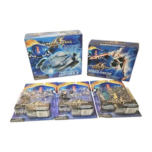 May include: A collection of Lost in Space toys including two large boxed vehicle sets, the Transforming Jupiter 2 and Eagle One Bubble Fighter, alongside three smaller blister-packed action figure sets featuring Major Don West, Professor John Robinson, and Will Robinson.
