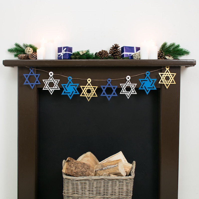 Large star of david garland with 8 stars strung across dark wood mantelpiece. Stars are gold, electric blue, white or navy blue.