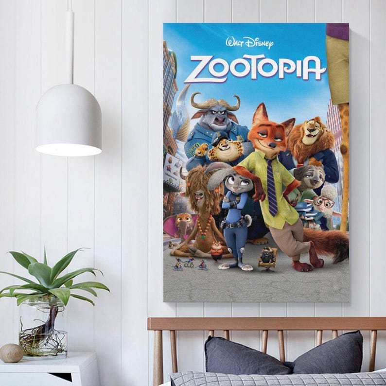 May include: A framed poster featuring the animated film "Zootopia." The poster showcases a vibrant ensemble of anthropomorphic animal characters against a cityscape backdrop. The title "Zootopia" is prominently displayed in bold, blue letters.