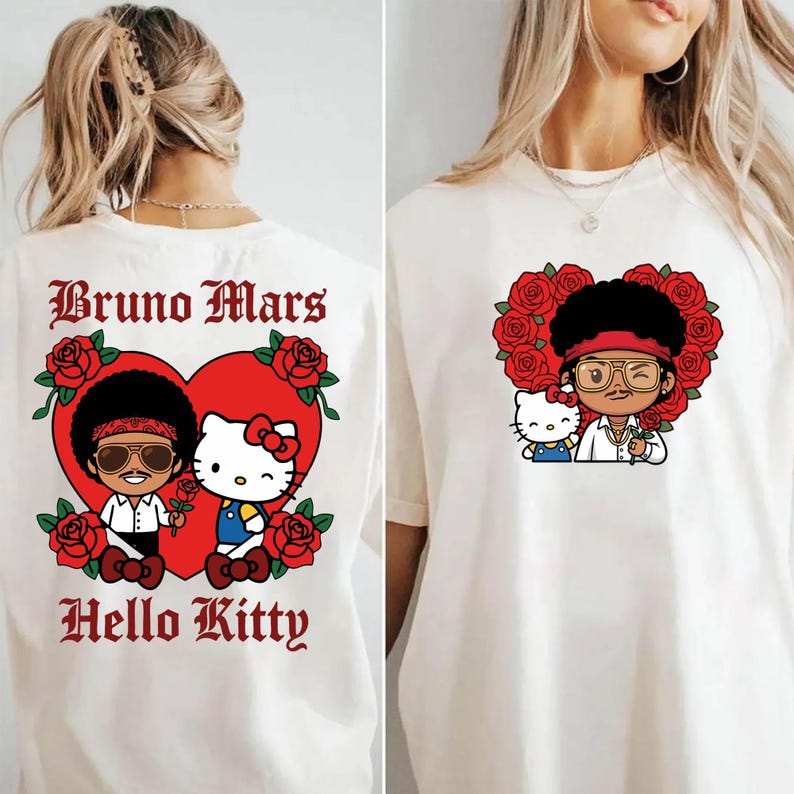 May include: Off-white t-shirt featuring a cartoon illustration of Bruno Mars and Hello Kitty inside a red heart surrounded by red roses. The text "Bruno Mars" and "Hello Kitty" are printed in a gothic font.