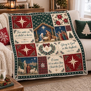 May include: A quilted Christmas throw blanket featuring a patchwork design with nativity scenes, poinsettias, and stars. Text includes 'For unto us a child is born', 'Glory to God in the highest', and 'O come let us adore Him Christ the Lord'.