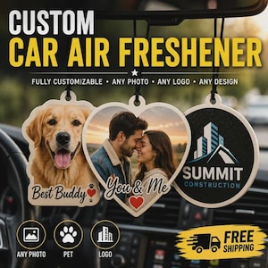 May include: Three hanging car air fresheners with custom prints: a die-cut golden retriever with the text Best Buddy, a heart-shaped photo of a couple with the text You & Me, and a circular logo for Summit Construction with a building graphic.