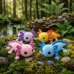 May include: Four crocheted axolotl plushies in light purple, bright yellow, soft pink, and light blue. Each stuffed animal features a rounded head, black bead eyes, and prominent external gills along the sides of the head and down the back.