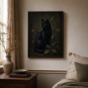 Black cat wall art print featuring a sleek black cat surrounded by belladonna flowers dark berries and moody foliage on a vintage gothic poison garden background.