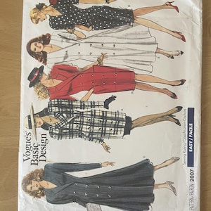 May include: A vintage Vogue's Basic Design sewing pattern from 2007. The cover shows illustrations of women in different coat and dress designs. The pattern is labelled "Easy" and includes a variety of styles.