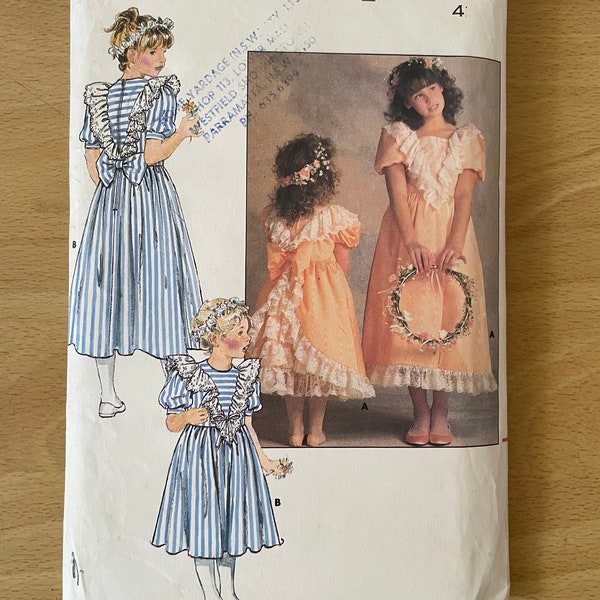 Butterick 4768 vintage 80s children’s dress with fitted bodice, raised waist, ruffles, sleeves, flared skirt and bow sewing pattern
