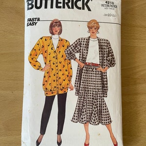 May include: A vintage sewing pattern from Butterick, pattern number 4218, for sizes 18-20-22. The pattern features two outfits: a yellow cardigan with a black and white print and black pants, and a black and white checkered jacket with a white top and a black and white checkered skirt.