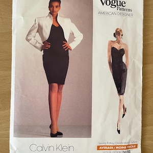 May include: A vintage Vogue Patterns sewing pattern featuring a Calvin Klein design. The pattern cover shows a woman in a black dress and white jacket. The text "Vogue Patterns AMERICAN DESIGNER" is visible.