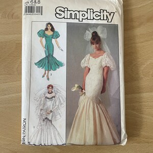 Simplicity 8425 vintage 80s wedding dress with princess seams, skirt, puffy sleeves, sweetheart neck and back button up sewing pattern