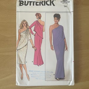 May include: A Butterick sewing pattern envelope showing illustrations of one-shoulder dresses in white, pink, and lavender. The pattern number is 3888, size 14. The envelope has the Butterick logo and store information.
