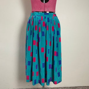 Vintage teal Sportscraft skirt with pockets and colourful rectangle pattern