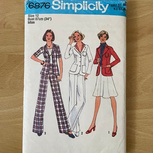 May include: Simplicity sewing pattern number 6876 for a women's blazer and pants set. The pattern includes three different styles: a plaid blazer and pants, a white blazer and pants, and a red blazer and skirt. The pattern is for size 12, with a bust measurement of 87 cm (34 inches).