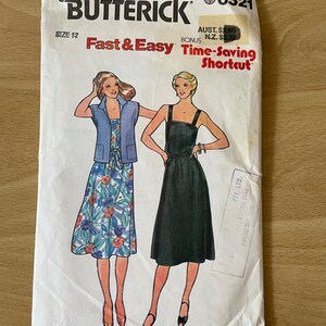 May include: A vintage sewing pattern for a dress, featuring two models wearing different versions of the dress. The pattern is labelled "Quick! Butterick 6521" and "Fast & Easy Time-Saving Shortcut".